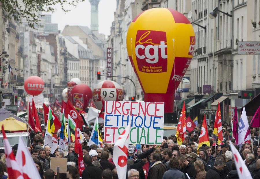 Demonstrators march in the annual May Day demonstration in Paris, France, May 1, 2013. (Xinhua/Etienne Laurent) 