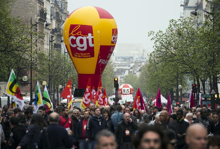 Demonstrators march in the annual May Day demonstration in Paris, France, May 1, 2013. (Xinhua/Etienne Laurent) 