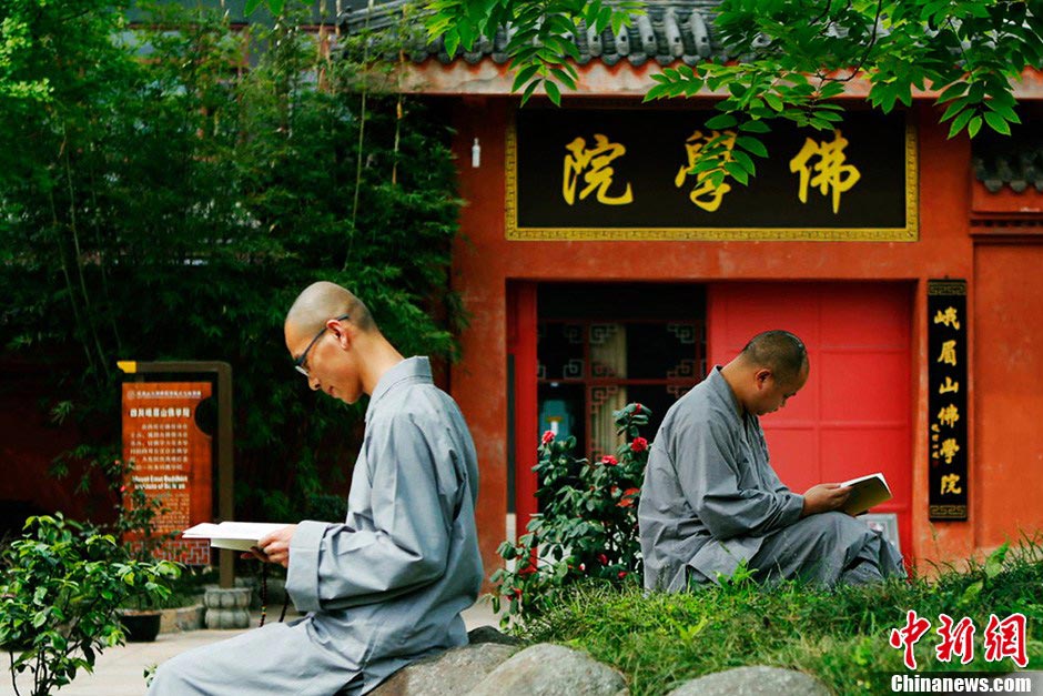 Two monks read books in the college. (CNS/Liu Zhongjun)