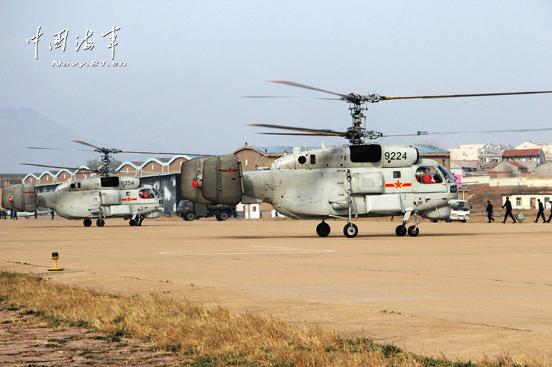 Ship-borne helicopters are in anti-submarine drills in the Yellow Sea under complicated weather conditions. (China Military Online)