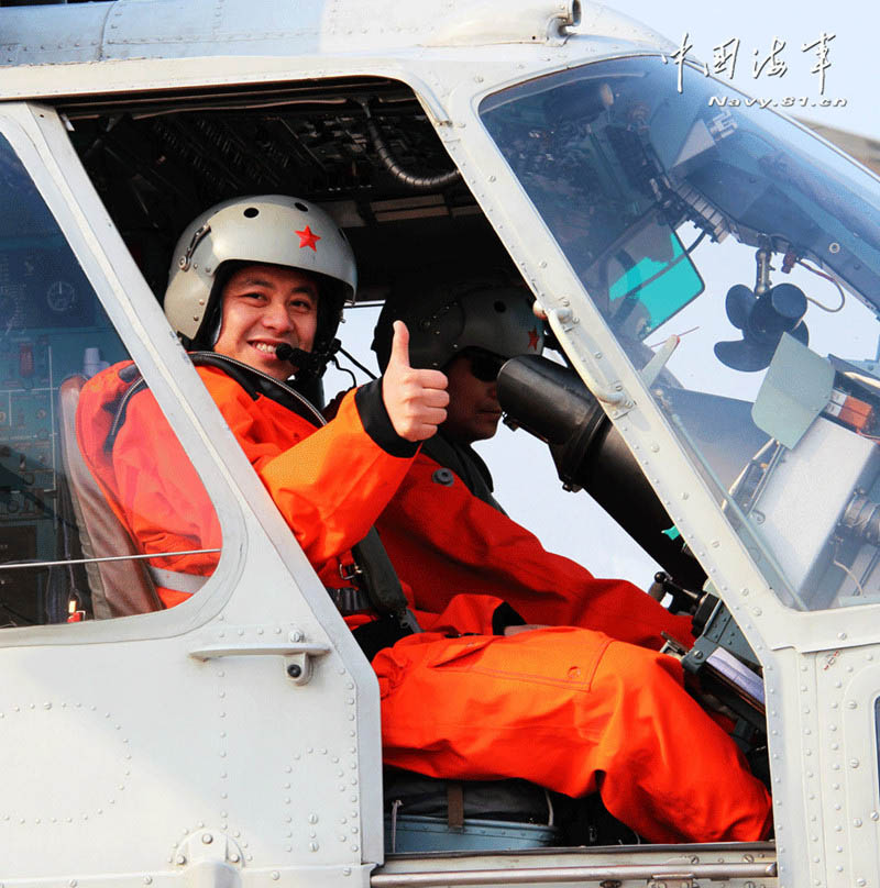 A ship-borne helicopter is in anti-submarine drills in the Yellow Sea under complicated weather conditions. (China Military Online)