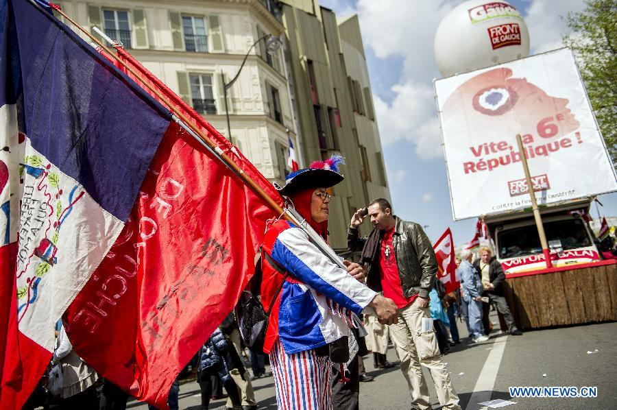 People participate in a demonstration in Paris, France, May 5, 2013. As the Socialists mark their first year in office, tens of thousands of protesters marched in towns across France on Sunday against president Francois Hollande's growth and job policy. (Xinhua/Etienne Laurent)