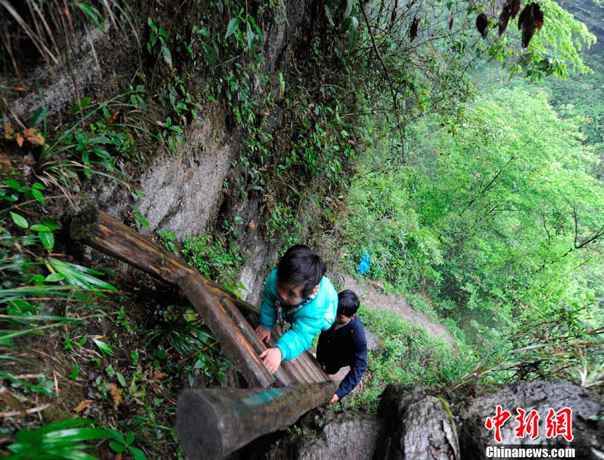 Zhangjiawan village is located on a remote mountain called “The Gate of Heaven” in central China's Hunan province, accessible only by ladders. The town was built hundreds of years ago to avoid bandits. Children here literally climb mountains to get to school. (Source: chinenews.com)