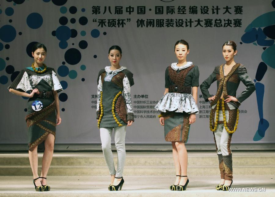 Models present creations made of warp knitted fabric during the 8th China International Knitting Design Awards in Shanghai, east China, May 11, 2013. (Xinhua/Shen Da) 