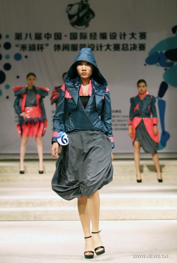 A model presents a creation made of warp knitted fabric during the 8th China International Knitting Design Awards in Shanghai, east China, May 11, 2013. (Xinhua/Shen Da) 