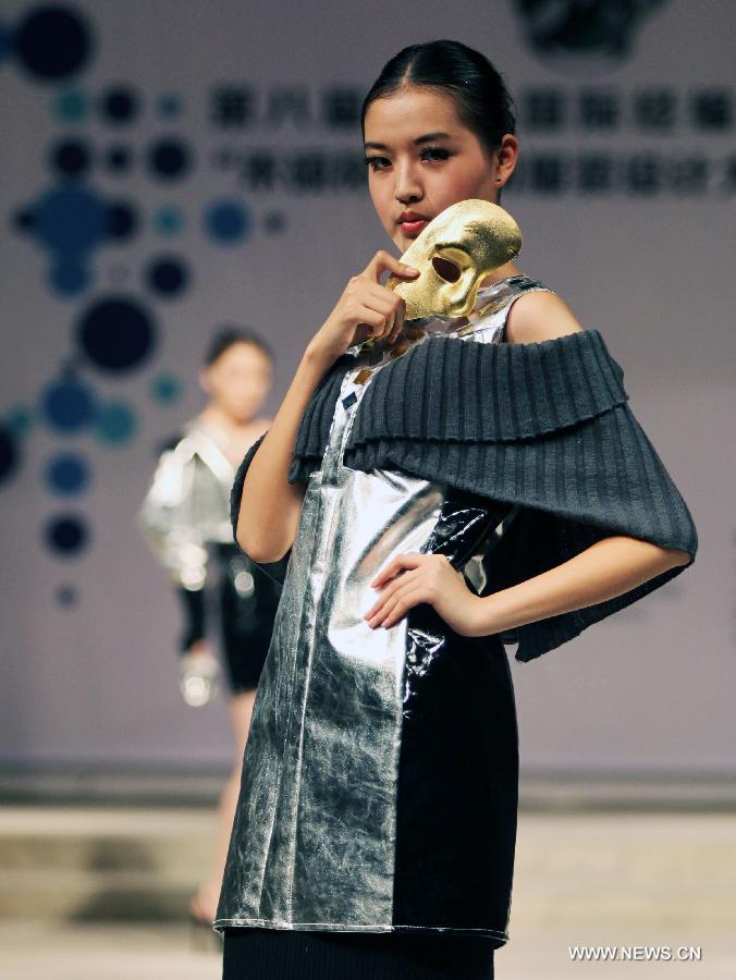 A model presents a creation made of warp knitted fabric during the 8th China International Knitting Design Awards in Shanghai, east China, May 11, 2013. (Xinhua/Shen Da) 