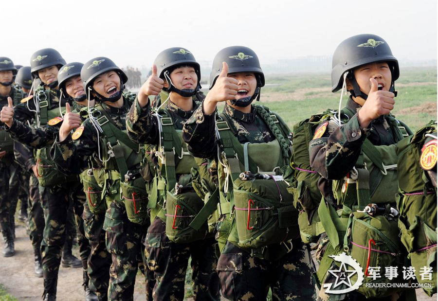 The members from the first female special operation company of the Army of the Chinese People's Liberation Army (PLAA) are in their first parachute landing training on May 14, 2013. (China Military Online/Cheng Jianfeng, Yan Xingxing)