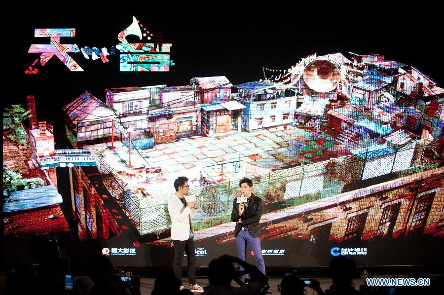 Jay Chou (R), director of movie "The Rooftop", attends a press conference of the movie in Beijing, capital of China, May 27, 2013. The movie is expected to be released in China on July 11, 2013. (Xinhua/Li Yan) 