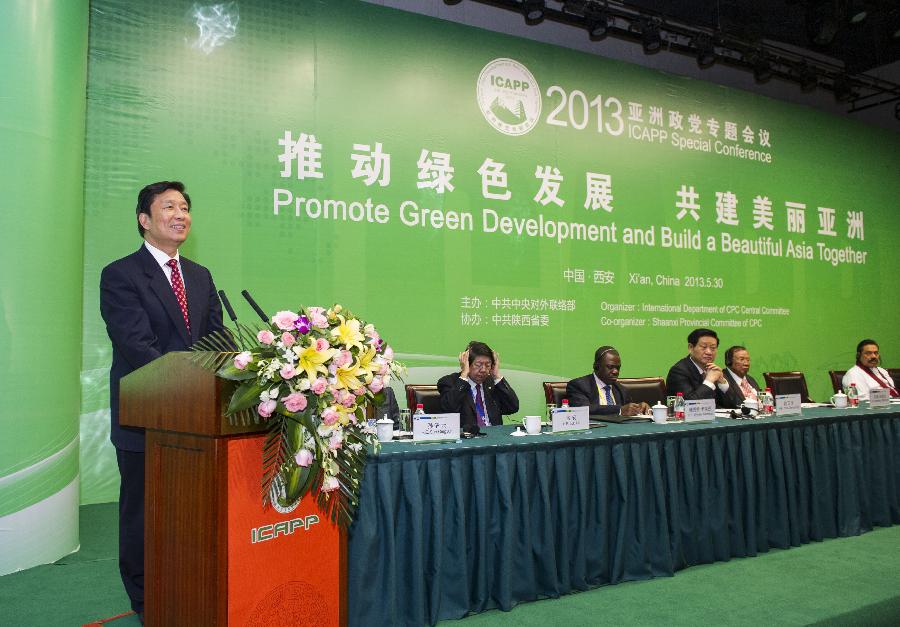 Chinese Vice President Li Yuanchao (L) addresses the opening ceremony of the 2013 International Conference of Asian Political Parties (ICAPP) Special Conference in Xi'an, capital of northwest China's Shaanxi Province, May 30, 2013. (Xinhua/Wang Ye)