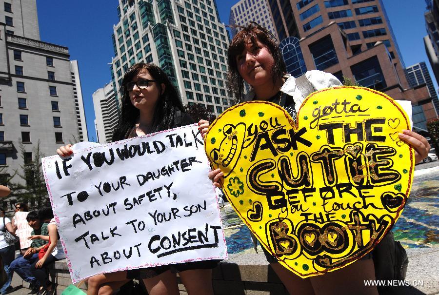 Participants march during a 2013 SlutWalk rally against sexual discrimination or inequality in Vancouver, Canada, on June 2, 2013. Slutwalk is a movement across the world, calling for equal rights for sex and genders' respect, which was provoked after a policeman advised young women to "avoid dressing like sluts" in Canada in April 2011. (Xinhua/Sergei Bachlakov) 