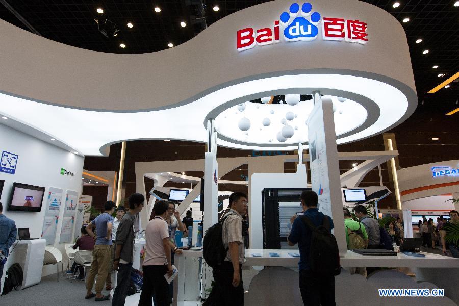 People visit the exhibition area of cloud computing service during the 5th China Cloud Computing Conference in Beijing, capital of China, June 5, 2013. The conference kicked off on June 5. (Xinhua/Liu Xin) 