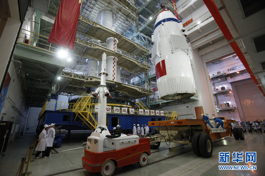 A spokesman from China’s manned space program says the Shenzhou-10 spacecraft will be launched in the middle of this month. The spacecraft will carry three astronauts to the Tiangong-1 space module. The assembly of the Shenzhou-10 spacecraft and the Long March-2F carrier rocket was transported to the launch site on June 3 at Jiuquan Satellite Launch Center in Jiuquan, northwest China's Gansu Province, which marks the manned Shenzhou-10 mission entering the final phase of its preparation. (Source: xinhuanet.com/mil)