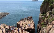 Tourists visit the Ninepin Group in Hong Kong