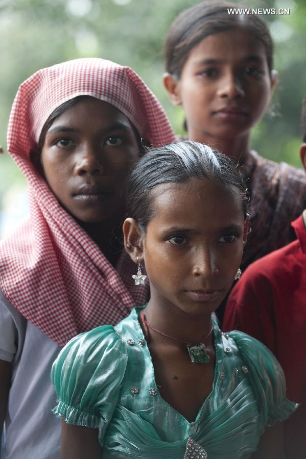 Indian rescued child laborers attend an awareness rally in Calcutta, Capital of eastern Indian state West Bengal, June 12, 2013. According to the International Labor Organization (ILO), an estimated 10.5 million children worldwide work as domestic workers. (Xinhua/Tumpa Mondal) 