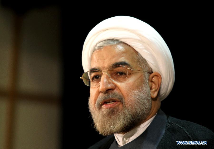 File photo taken on May 7, 2013 shows Iran's former nuclear negotiator Hassan Rouhani reacting at a press conference after registration for Iran's 11th presidential election at the interior ministry in Tehran. Hassan Rouhani defeated his rival conservative candidates in Iran's 2013 presidential election Saturday by gaining 18,613,329 votes out of counted votes of 36,704,156, accounting for 50.7 percent of all the votes, with a turnout rate of 72.2 percent. (Xinhua/Ahmad Halabisaz) 