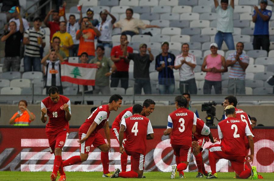 Tahiti's players celebrates after scoring during the FIFA's Confederations Cup Brazil 2013 match against Nigeria, held at Mineirao Stadium, in Belo Horizonte, Minas Gerais state, Brazil, on June 17, 2013. (Xinhua/David de la Paz)