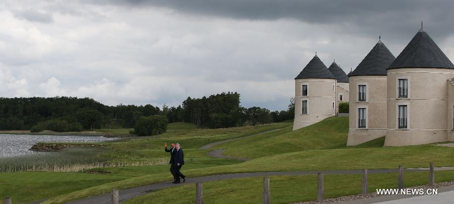 US President Barack Obama (L) talks with Canada's Prime Minister Stephen Harper at the Lough Erne resort near Enniskillen in Northern Ireland, UK, June 18, 2013. G8 and EU leaders gathered in Lough Erne on Tuesday for the second and final day of their summit.(Xinhua/Yin Gang) 