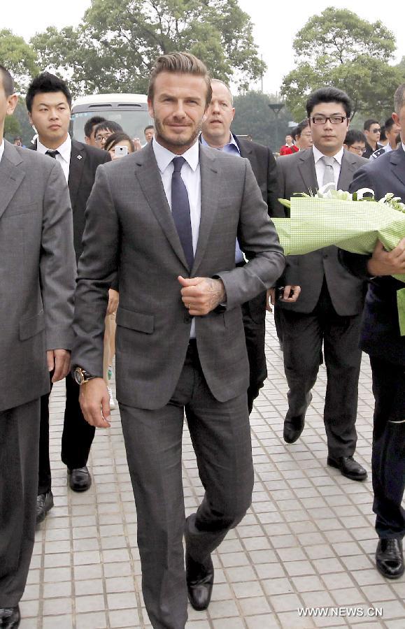 Recently retired football player David Beckham arrives in Shanghai, east China, June 19, 2013. David Beckham is on a seven-day visit to China as the ambassador for the Football Programme in China and China's Super League. (Xinhua/Fan Jun)