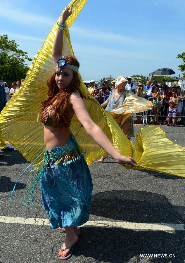 Revelers participate in the 2013 Mermaid Parade at Coney Island in New York on June 22, 2013. (Xinhua/Wang Lei)