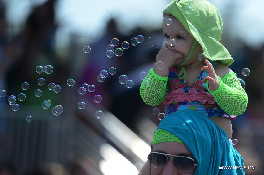 People participate in the 2013 Mermaid Parade at Coney Island in New York on June 22, 2013. (Xinhua/Wang Lei) 