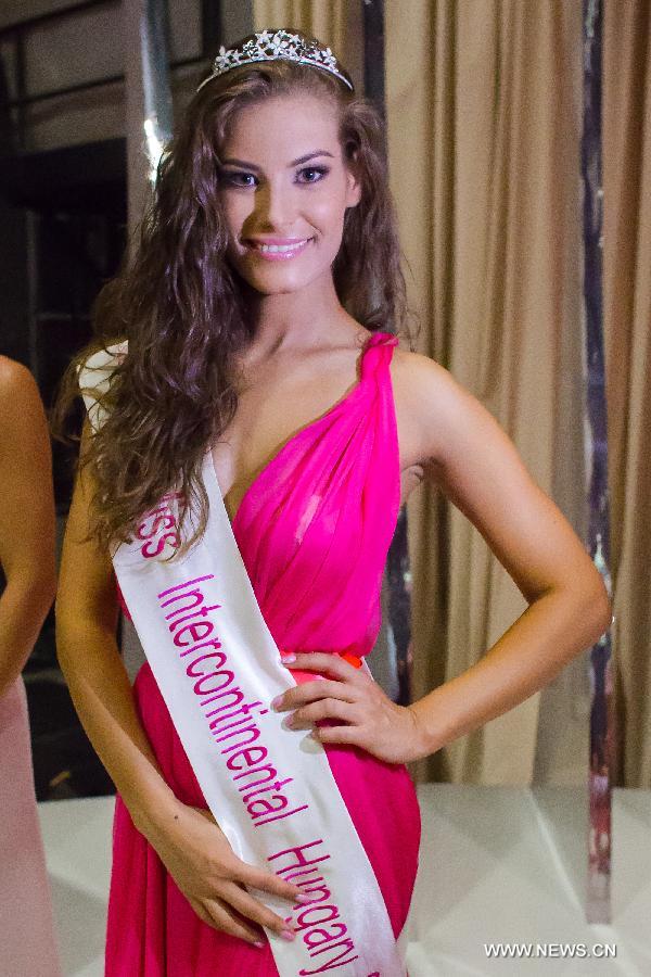 Brigitta Timar of Hungary is crowned as the winner of the Miss Intercontinental Hungary in a beauty contest held in Budapest, Hungary on June 22, 2013. Miss World Hungary, Miss Universe Hungary and Miss Intercontinental Hungary were chosen in the beauty contest hosted by Hungary's tv2. (Xinhua/Attila Volgyi)