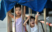 Girls locked in cage-like tricycle on their way home