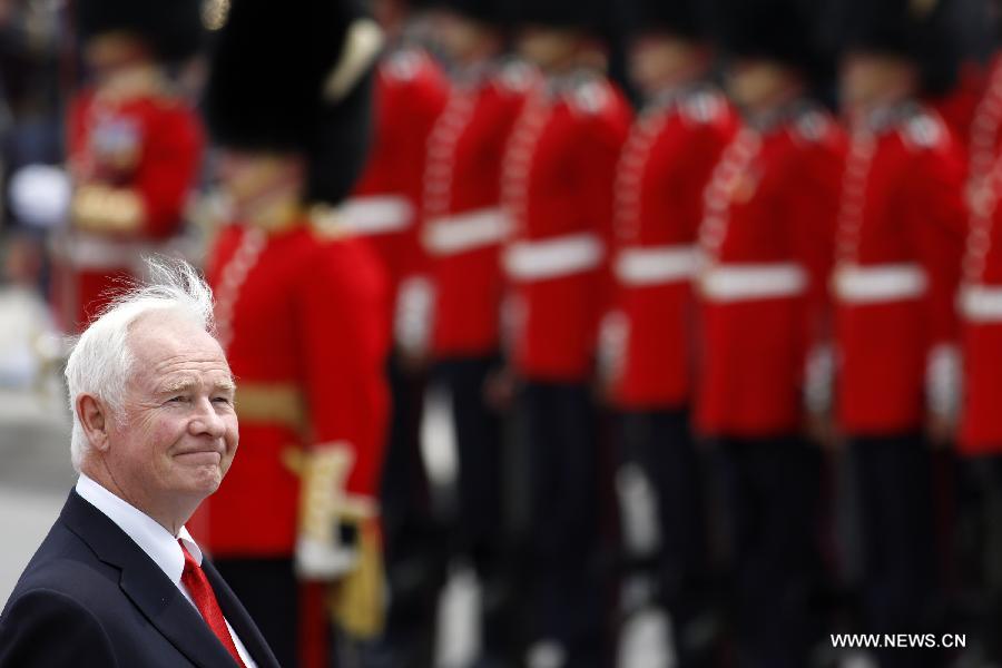 Canada's Governor-General David Johnston inspects the honor guards as a part of Canada Day celebrations in Ottawa, capital of Canada, on July 1, 2013. Celebrations were held across the country to mark the 146th anniversary of Canada's foundation. (Xinhua/David Kawai) 