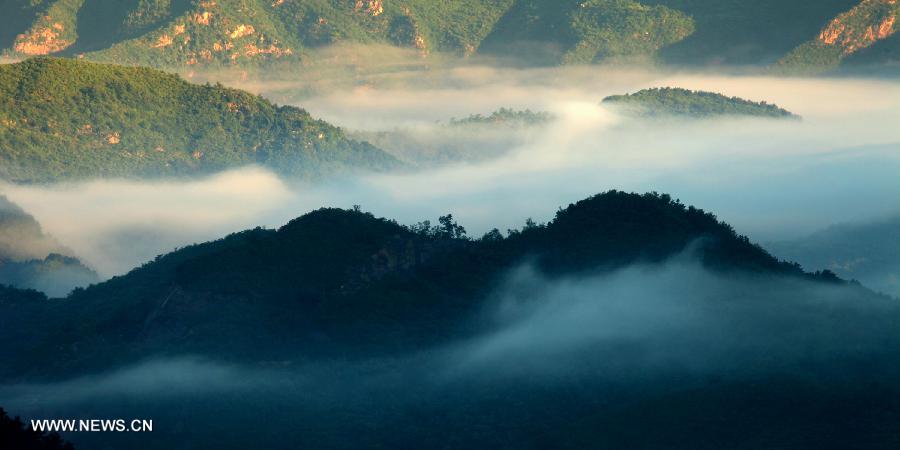 Photo taken on July 3, 2013 shows the scenery of the mountainous areas in Liulimiao Village of Huairou District, Beijing, capital of China. (Xinhua/Bu Xiangdong) 