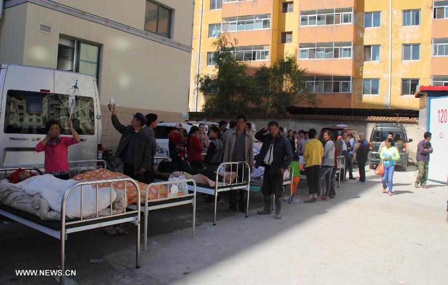 Victims of an earthquake receive treatment at a hospital in Minxian County, northwest China's Gansu Province, July 22, 2013. At least 56 people were killed and 14 others are missing as of 3 p.m. on Monday following the 6.6-magnitude earthquake striking at 7:45 a.m. on Monday at the border of Minxian County and Zhangxian County in the city of Dingxi. Another 392 people were injured in the quake, which also cut off communications in 13 townships in Zhangxian, according to the provincial earthquake emergency response center. (Xinhua/Han Congzhi)