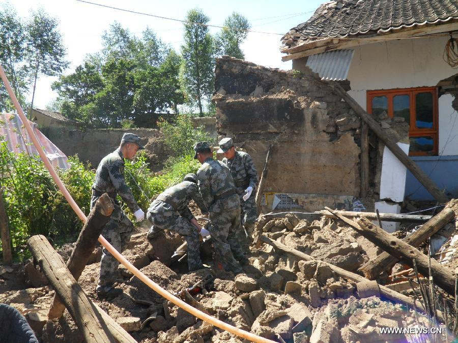 Rescuers work at Yongguang Village of Meichuan Town in Minxian County, northwest China's Gansu Province, July 22, 2013. The death toll has climbed to 89 in the 6.6-magnitude earthquake which jolted a juncture region of Minxian County and Zhangxian County in Dingxi City Monday morning. (Xinhua/Zhang Yongjin) 