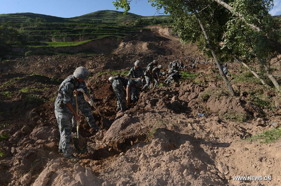 Rescuers work at Yongguang Village of Meichuan Town in Minxian County, northwest China's Gansu Province, July 22, 2013. The death toll has climbed to 89 in the 6.6-magnitude earthquake which jolted a juncture region of Minxian County and Zhangxian County in Dingxi City Monday morning. (Xinhua/Zhang Yongjin) 