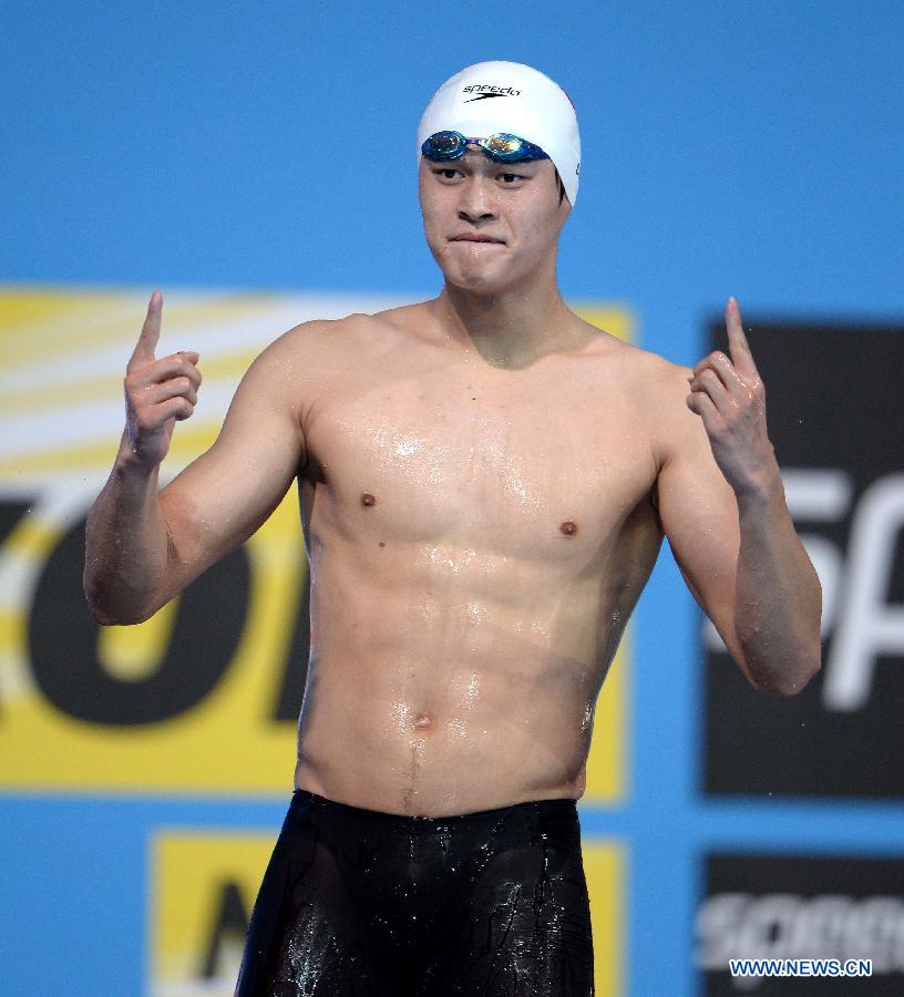 Sun Yang of China celebrates after the Men's 400m Freestyle Final of the Swimming competition on day 9 of the 15th FINA World Championships at Palau Sant Jordi in Barcelona, Spain on July 28, 2013. Sun Yang claimed the title with 3 minutes 41.59 seconds.(Xinhua/Guo Yong) 