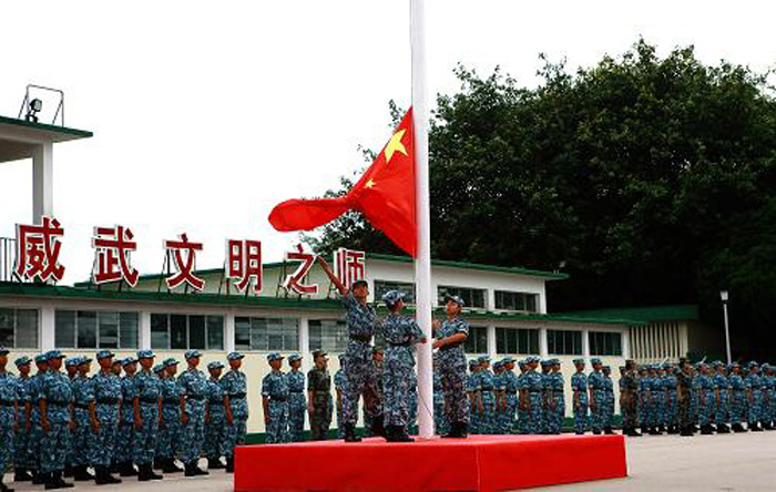 The picture shows Hong Kong teenagers attend a graduation ceremony of the military summer camp on July 28, 2013.  (Photo by Lyu Xiaowei)