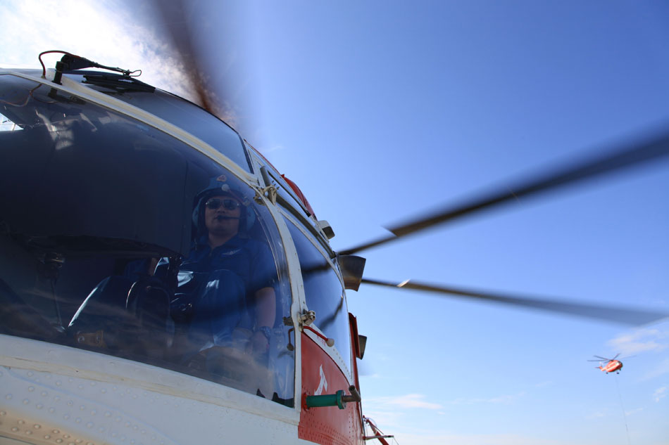 Two helicopters of the Forest Police have a flight drill in Daqing to celebrate the Army Day (August 1). With the mass military drills, the helicopter contingent hoped to improve the skills for enforcement and pay the deepest tribute to 86th anniversary of the founding of the PLA. (Xinhua/Han Xinghua)