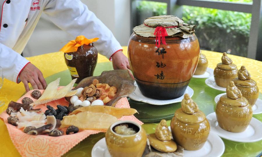 Photo taken on Jan. 12, 2014 shows the ingredients of a dish named Buddha Jumps Over the Wall, in Fuzhou, capital of southeast China's Fujian Province. Buddha Jumps Over the Wall, or Fo Tiao Qiang in Chinese, is a kind of soup or stew which has enjoyed a over 100-year-long worldwide reputation since it was invented in the late Qing Dynasty (1644-1911) by Zheng Chunfa, a chief chef at a local restaurant. The dish's name is referred to an allusion to its ability to entice the vegetarian monks to partake in the meat-based dish from their temples. Ingredients of the dish consists of sea cucumber, abalone, fish fin, etc, owing to which, it smells mellow and tastes extremely delicious with a high nutrition at the same time. (Xinhua/Lin Shanchuan)