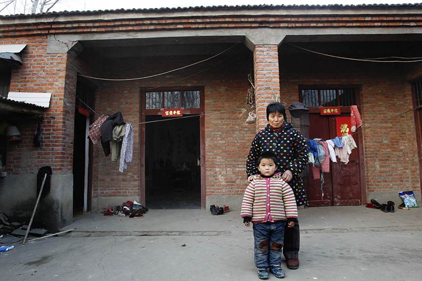 Like many other children in rural China, 5-year-old Ruan Cheng longs for the moment his parents come home from their jobs in a faraway city for the Lunar New Year, or Spring Festival. (Xinhua/Pei Xin)